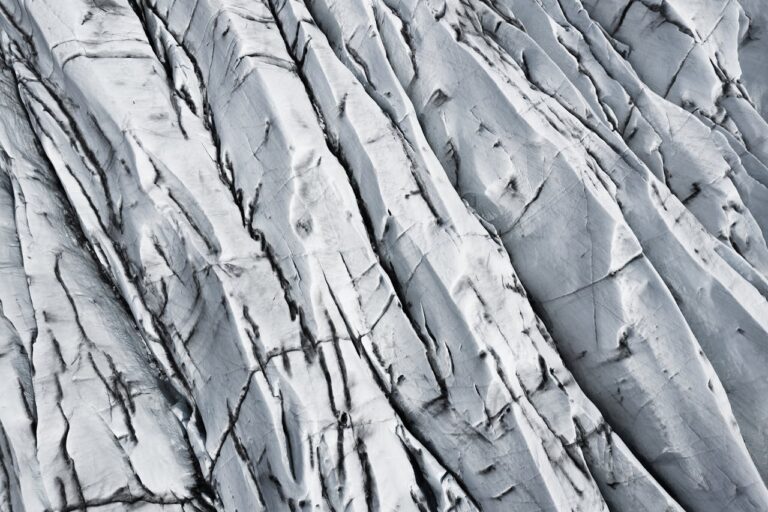 Detailed close-up of Icelandic glacier showcasing natural ice patterns and textures.